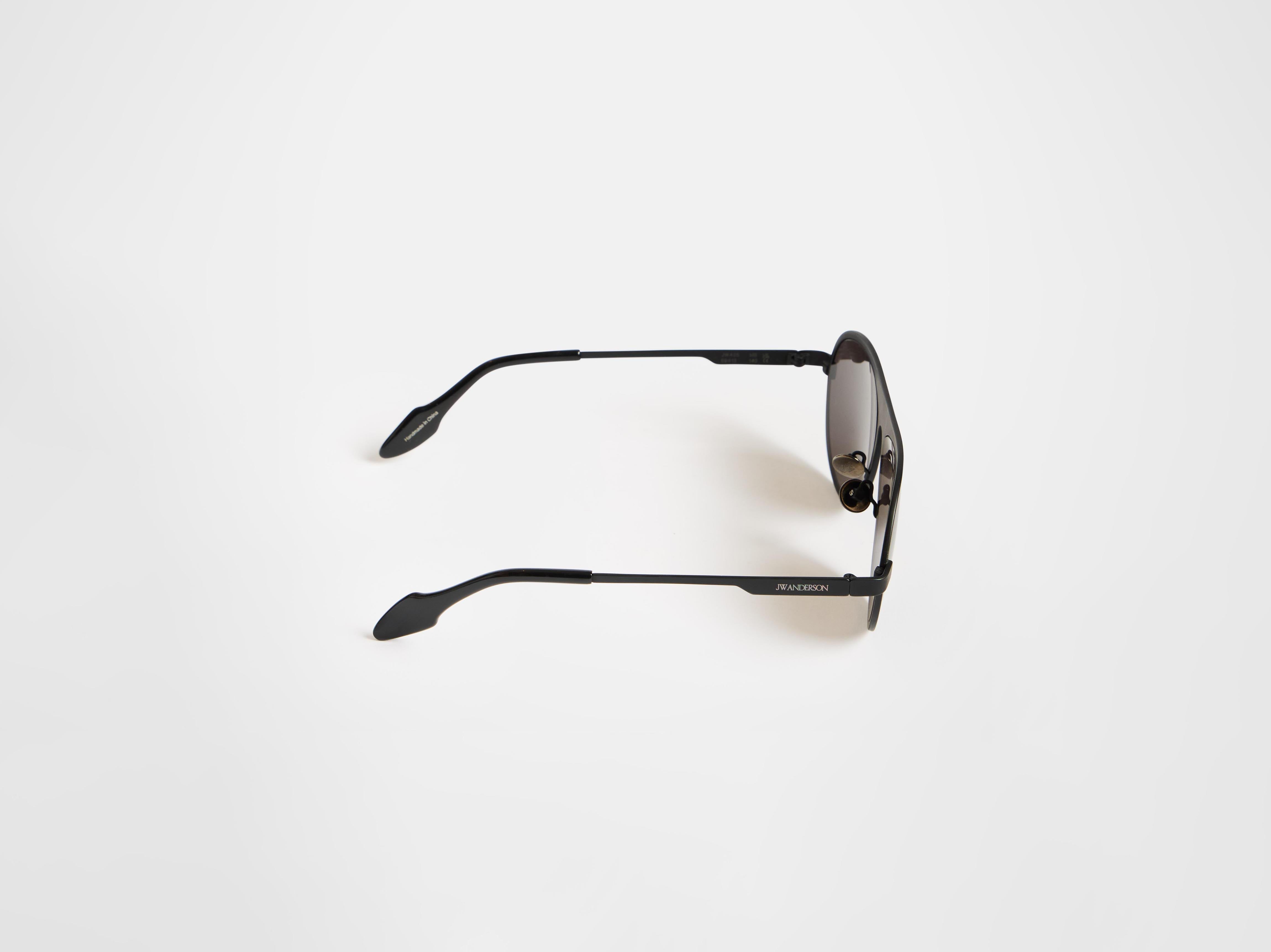 J.W.Anderson JWA05 Aviator Sonnenbrille Schwarz Titan