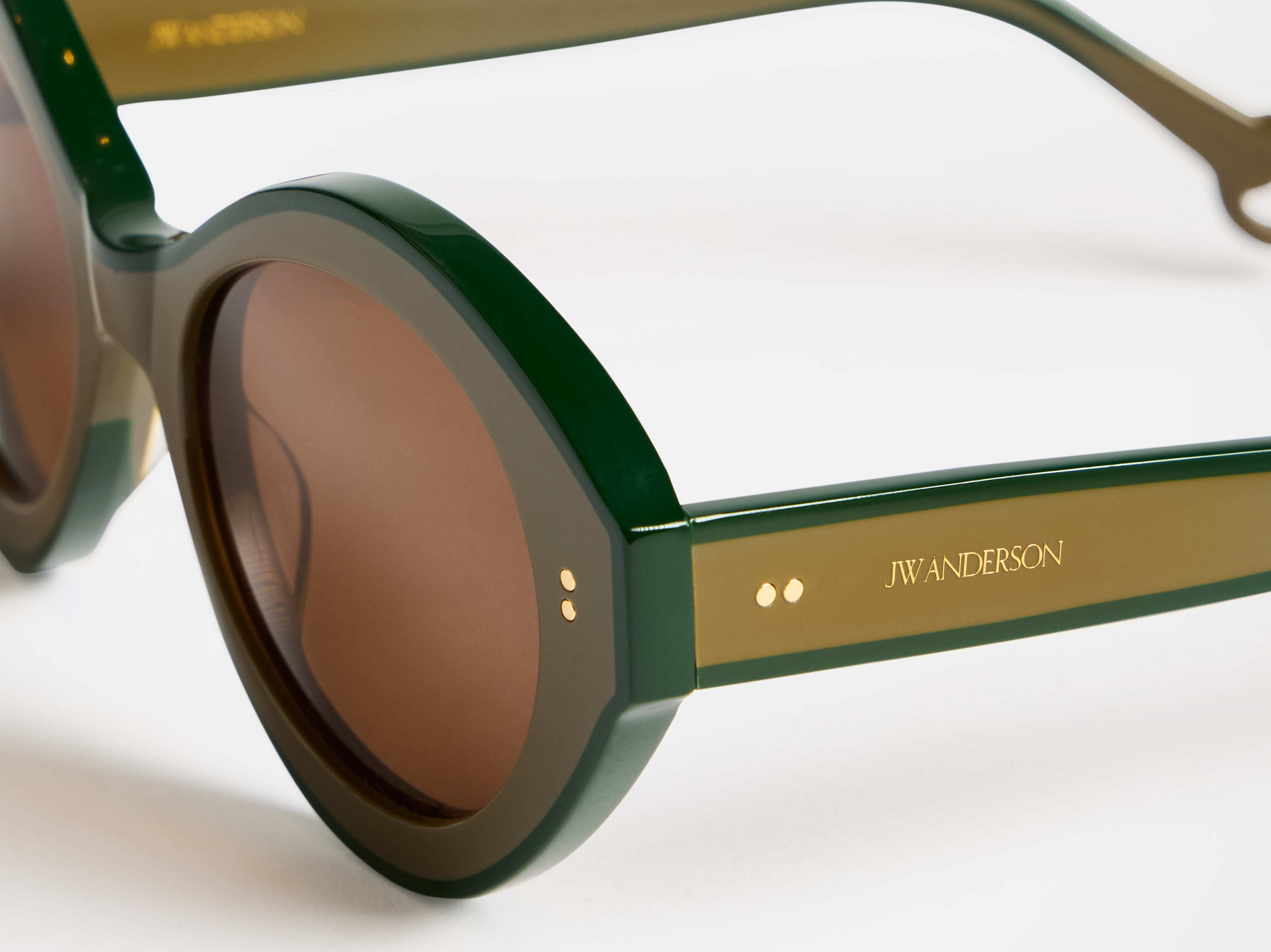 J.W.Anderson JWA07 Bumper Sonnenbrille Braun Grün Acetat