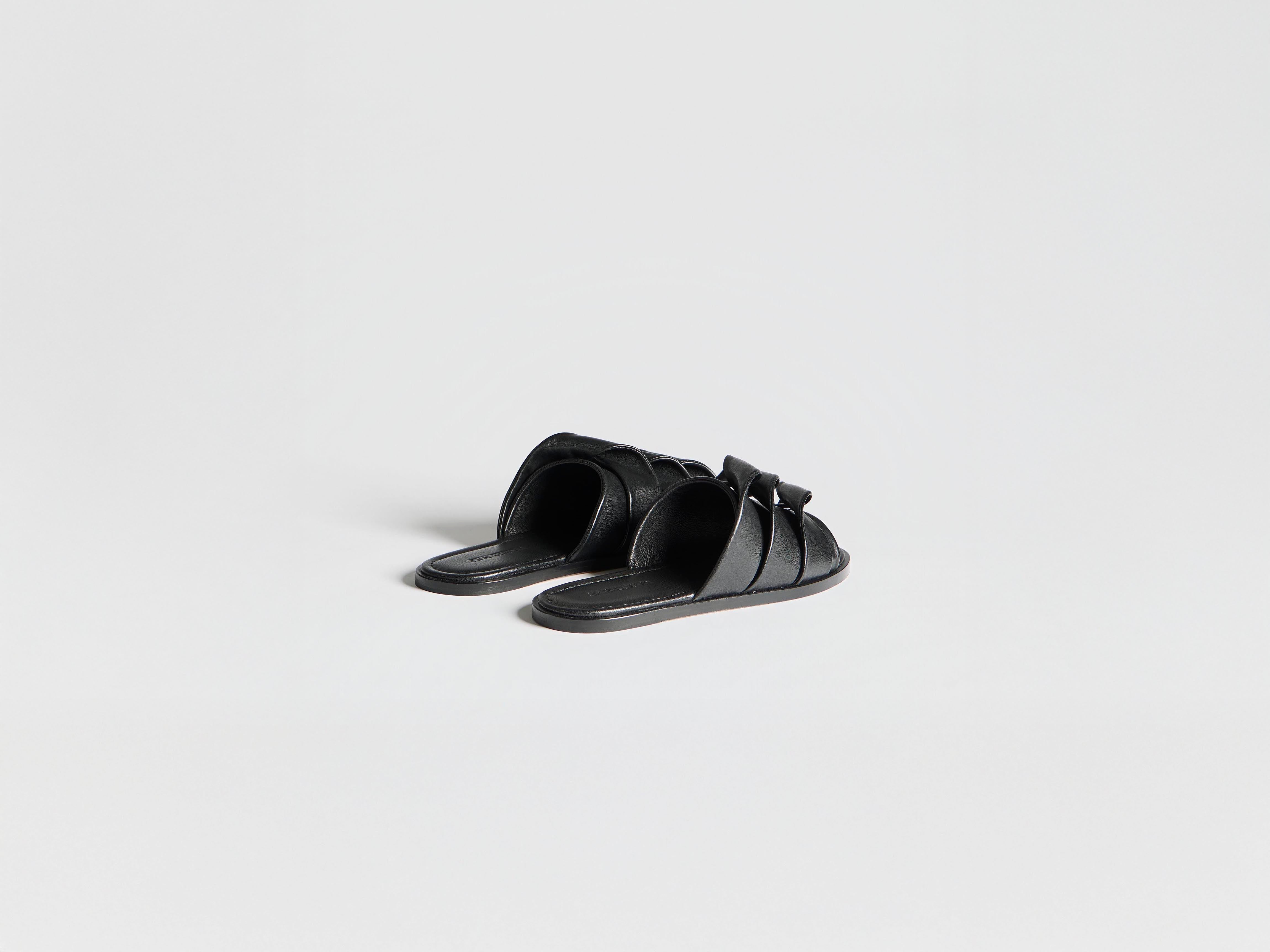 J.W.Anderson Shoes Contrasting Coil Slide Sandalen Schwarz Leder